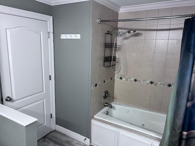 8594 Morgan Ln, Orange, TX 77632 - full bathroom featuring crown molding, shower / bath combination with curtain, and baseboards