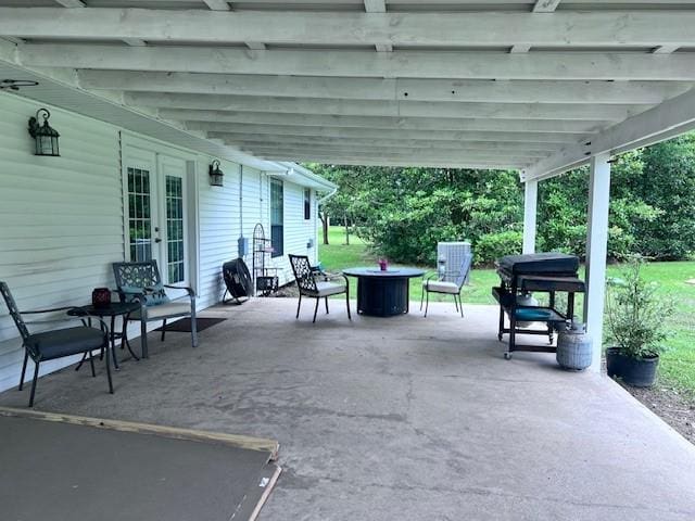 8594 Morgan Ln, Orange, TX 77632 - view of patio / terrace with french doors and a fire pit
