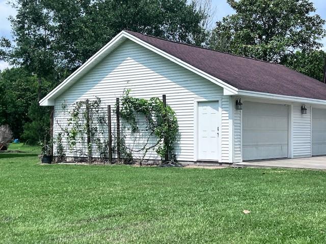 8594 Morgan Ln, Orange, TX 77632 - view of side of property featuring a lawn