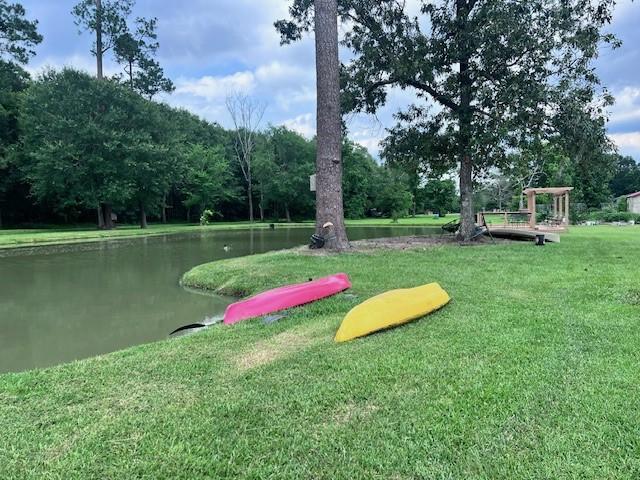 8594 Morgan Ln, Orange, TX 77632 - view of home's community with a yard and a water view