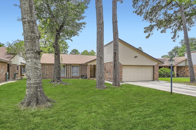 9519 Landry Blvd, Spring, TX 77379 - mid-century modern home featuring brick siding, an attached garage, driveway, and a front lawn