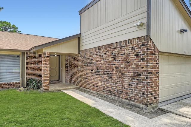 9519 Landry Blvd, Spring, TX 77379 - view of exterior entry featuring brick siding and a yard