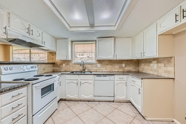 9519 Landry Blvd, Spring, TX 77379 - kitchen featuring white appliances, a sink, under cabinet range hood, and white cabinets