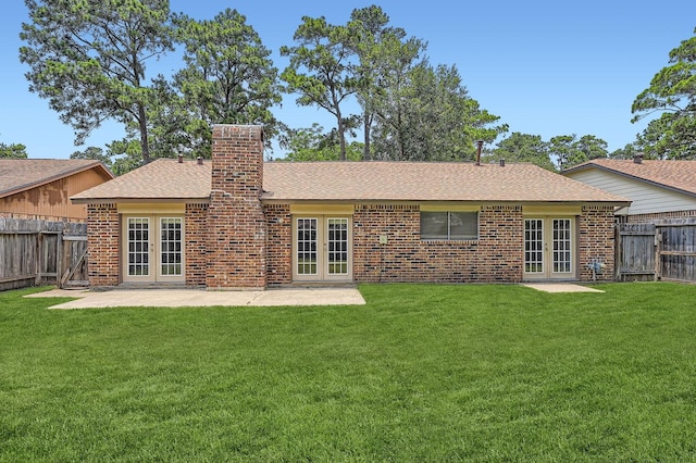 9519 Landry Blvd, Spring, TX 77379 - rear view of property with french doors, roof with shingles, a chimney, a patio, and brick siding