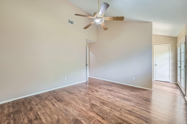 9519 Landry Blvd, Spring, TX 77379 - spare room featuring wood finished floors, a ceiling fan, high vaulted ceiling, and baseboards