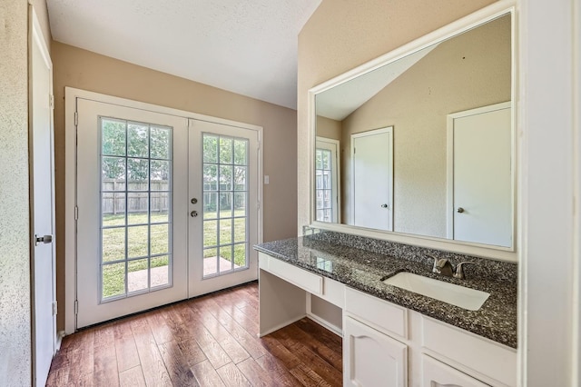 9519 Landry Blvd, Spring, TX 77379 - doorway to outside featuring a sink, lofted ceiling, french doors, and dark wood-style flooring
