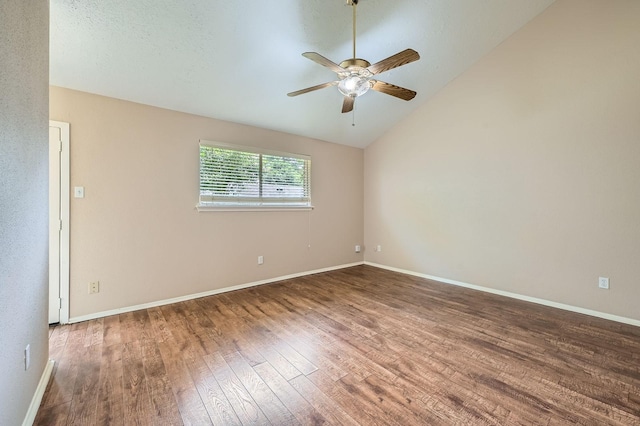 9519 Landry Blvd, Spring, TX 77379 - unfurnished room with wood finished floors, vaulted ceiling, ceiling fan, and baseboards