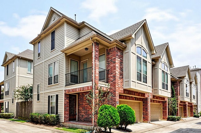 2366 Bastrop St, Houston, TX 77004 - view of building exterior with an attached garage and driveway