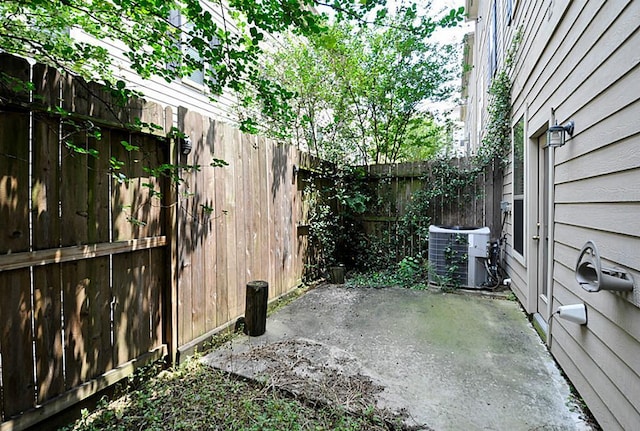 2366 Bastrop St, Houston, TX 77004 - fenced backyard featuring central AC and a patio
