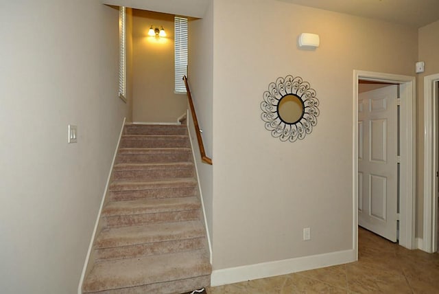 2366 Bastrop St, Houston, TX 77004 - stairs featuring baseboards and tile patterned flooring