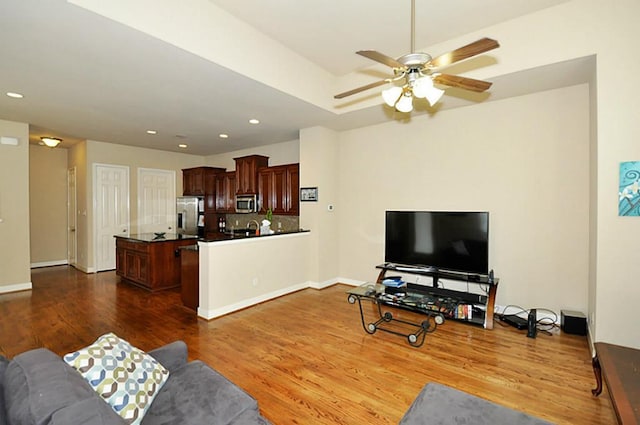 2366 Bastrop St, Houston, TX 77004 - living area with dark wood-type flooring, a ceiling fan, recessed lighting, and baseboards