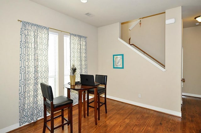 2366 Bastrop St, Houston, TX 77004 - dining space with wood finished floors, baseboards, stairway, and a desk