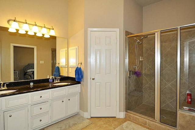 2366 Bastrop St, Houston, TX 77004 - bathroom featuring double vanity, a stall shower, and tile patterned flooring