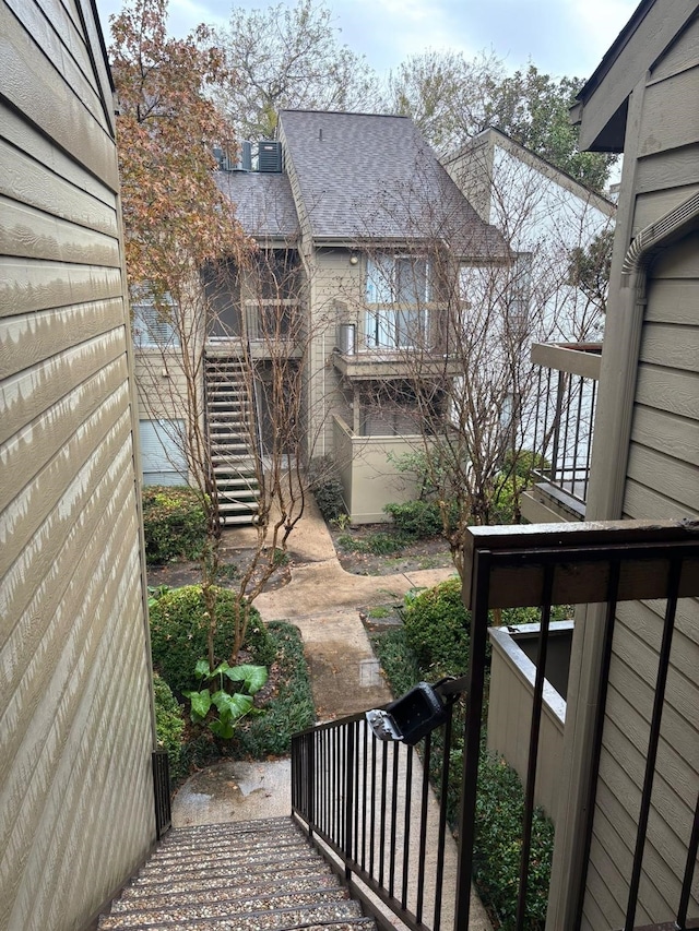 10049 Westpark Dr Unit 120, Houston, TX 77042 - exterior space featuring roof with shingles
