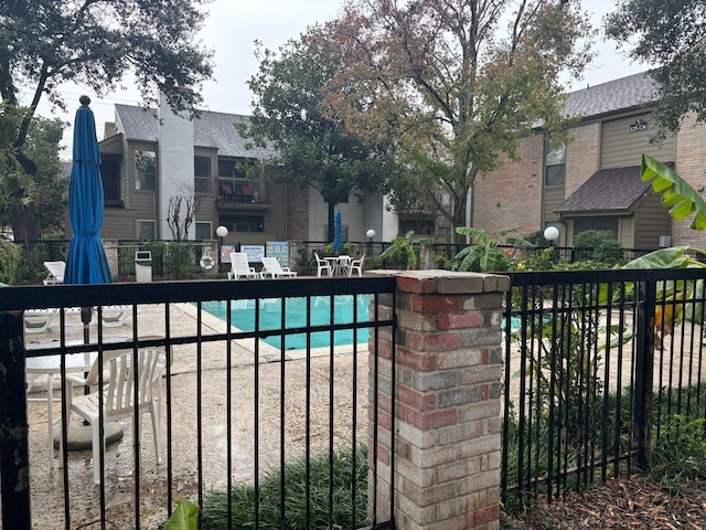 10049 Westpark Dr Unit 120, Houston, TX 77042 - community pool with a patio