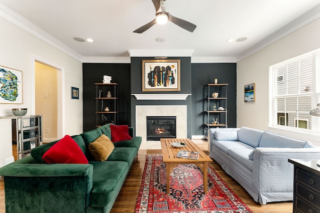 1221 W 25th St Unit D, Houston, TX 77008 - living room featuring wood finished floors, ceiling fan, ornamental molding, a tiled fireplace, and recessed lighting