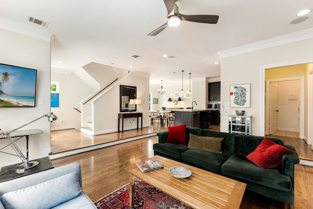 1221 W 25th St Unit D, Houston, TX 77008 - living room with crown molding, stairs, ceiling fan, light wood-style flooring, and recessed lighting