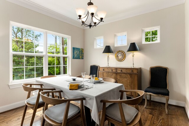 1221 W 25th St Unit D, Houston, TX 77008 - dining space featuring baseboards, a chandelier, crown molding, and light wood-style floors