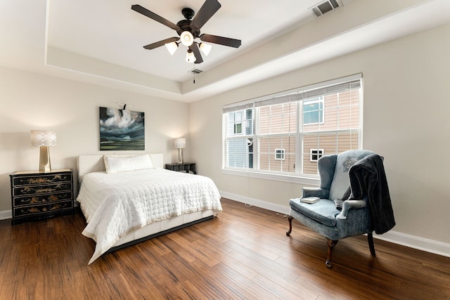 1221 W 25th St Unit D, Houston, TX 77008 - bedroom featuring baseboards, wood finished floors, a tray ceiling, and ceiling fan