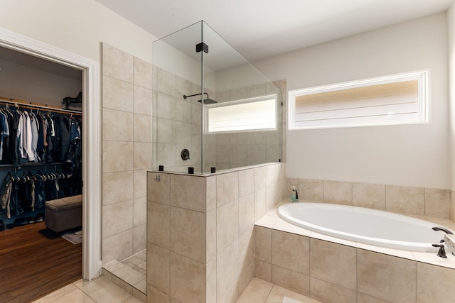 1221 W 25th St Unit D, Houston, TX 77008 - bathroom with a garden tub, walk in shower, tile patterned floors, and a spacious closet