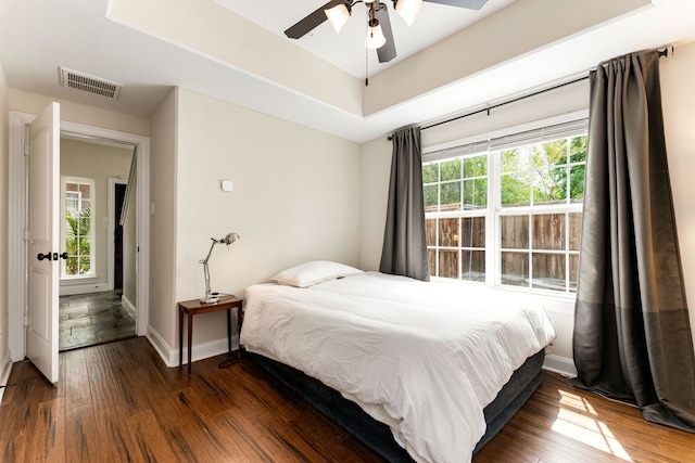 1221 W 25th St Unit D, Houston, TX 77008 - bedroom with wood finished floors, baseboards, and a ceiling fan
