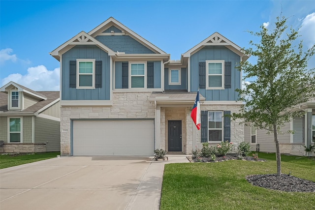23834 Thistle Spud Ln, Hockley, TX 77447 - view of front facade with board and batten siding, stone siding, an attached garage, and a front yard
