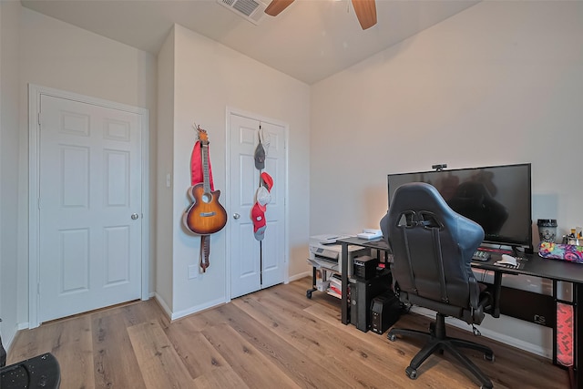 23834 Thistle Spud Ln, Hockley, TX 77447 - home office with wood finished floors, ceiling fan, and baseboards