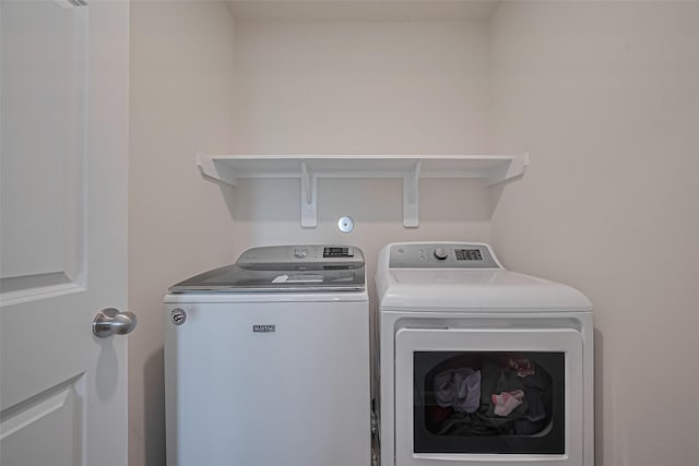 23834 Thistle Spud Ln, Hockley, TX 77447 - washroom featuring washing machine and dryer