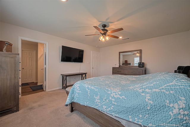 23834 Thistle Spud Ln, Hockley, TX 77447 - bedroom with light carpet, baseboards, and a ceiling fan