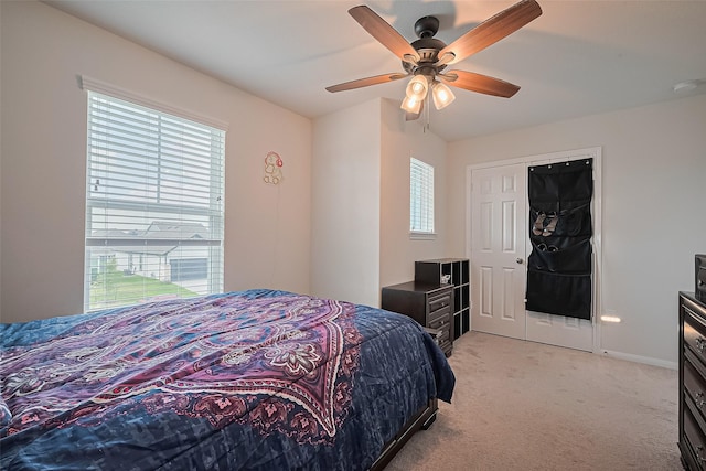 23834 Thistle Spud Ln, Hockley, TX 77447 - bedroom featuring light colored carpet, a ceiling fan, and baseboards