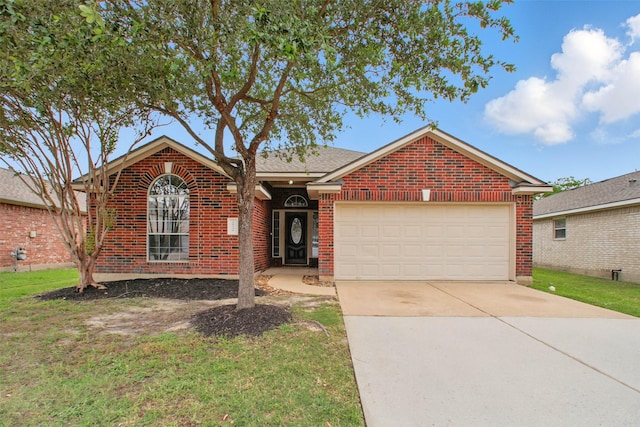 18330 Melissa Springs Dr, Tomball, TX 77375 - ranch-style house with brick siding, a garage, a front yard, and concrete driveway