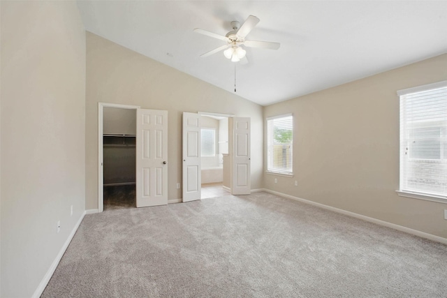 18330 Melissa Springs Dr, Tomball, TX 77375 - unfurnished bedroom featuring carpet flooring, a spacious closet, baseboards, vaulted ceiling, and a closet