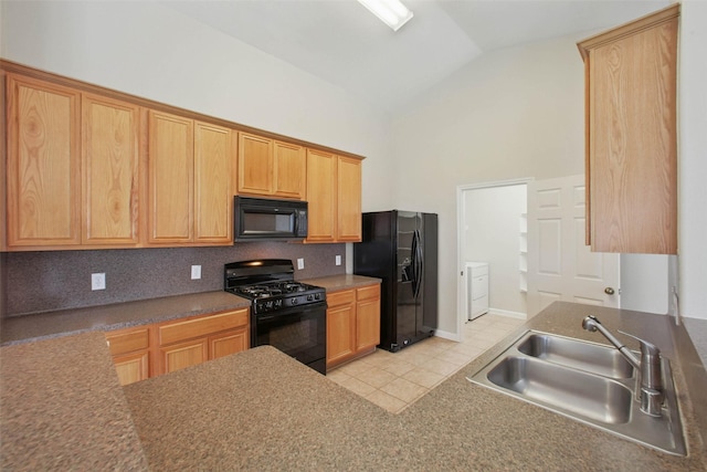 18330 Melissa Springs Dr, Tomball, TX 77375 - kitchen featuring black appliances, a sink, washer and clothes dryer, light tile patterned flooring, and decorative backsplash