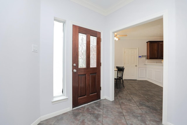 4256 Childress St, Houston, TX 77005 - foyer entrance with ornamental molding, ceiling fan, and baseboards
