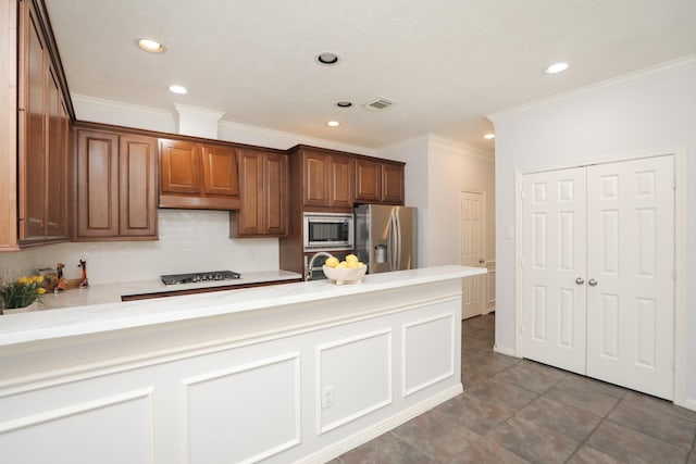 4256 Childress St, Houston, TX 77005 - kitchen featuring appliances with stainless steel finishes, recessed lighting, light countertops, crown molding, and tasteful backsplash