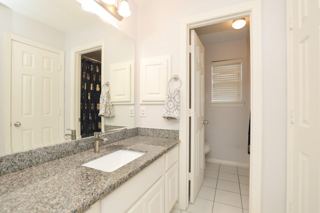 4256 Childress St, Houston, TX 77005 - full bath with toilet, vanity, tile patterned floors, and baseboards