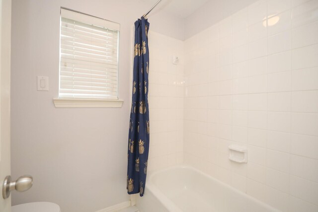 4256 Childress St, Houston, TX 77005 - full bathroom with shower / bathtub combination with curtain, baseboards, and toilet