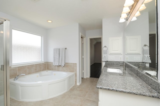 4256 Childress St, Houston, TX 77005 - bathroom with double vanity, a garden tub, tile patterned flooring, and a chandelier