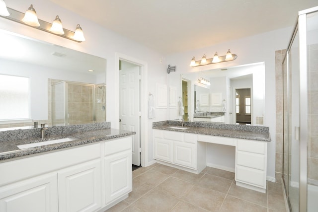 4256 Childress St, Houston, TX 77005 - bathroom with a shower stall, two vanities, and tile patterned flooring