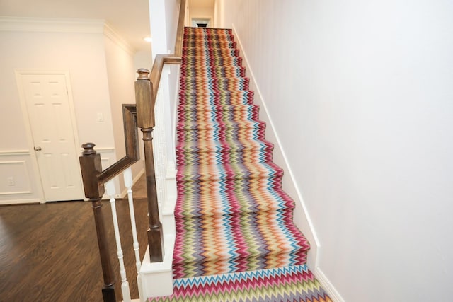 4256 Childress St, Houston, TX 77005 - stairway featuring crown molding, wood finished floors, and baseboards