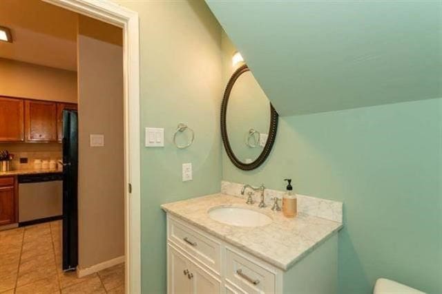 1620 Wellington Pl Unit 303, Beaumont, TX 77706 - bathroom with vanity, tile patterned floors, and toilet