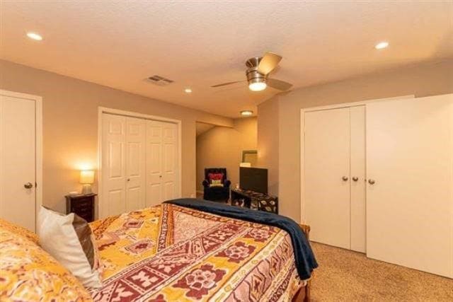 1620 Wellington Pl Unit 303, Beaumont, TX 77706 - carpeted bedroom featuring multiple closets, recessed lighting, and a ceiling fan