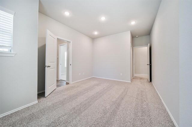 1452 Glenoaks Dr, Conroe, TX 77385 - unfurnished room featuring carpet flooring, baseboards, and recessed lighting