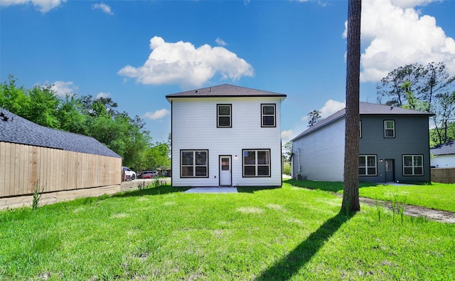1452 Glenoaks Dr, Conroe, TX 77385 - rear view of house with a patio and a yard