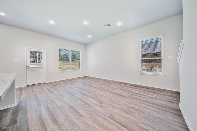 1452 Glenoaks Dr, Conroe, TX 77385 - spare room with light wood-style flooring, recessed lighting, and baseboards