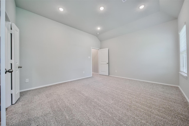 1452 Glenoaks Dr, Conroe, TX 77385 - carpeted spare room with baseboards, vaulted ceiling, and recessed lighting