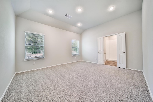 1452 Glenoaks Dr, Conroe, TX 77385 - unfurnished bedroom with lofted ceiling, carpet, baseboards, and recessed lighting