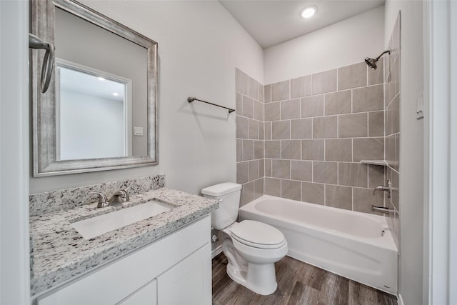 1452 Glenoaks Dr, Conroe, TX 77385 - full bath with toilet, vanity, wood finished floors, shower / washtub combination, and recessed lighting