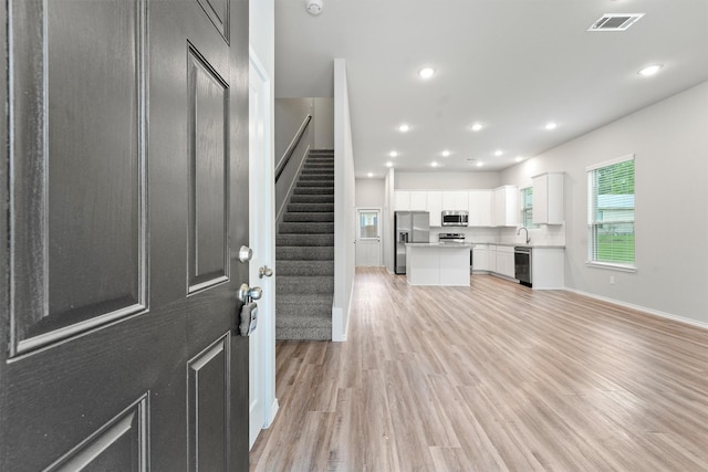 705 Little River Dr, Montgomery, TX 77316 - foyer with stairs, light wood-type flooring, recessed lighting, and baseboards