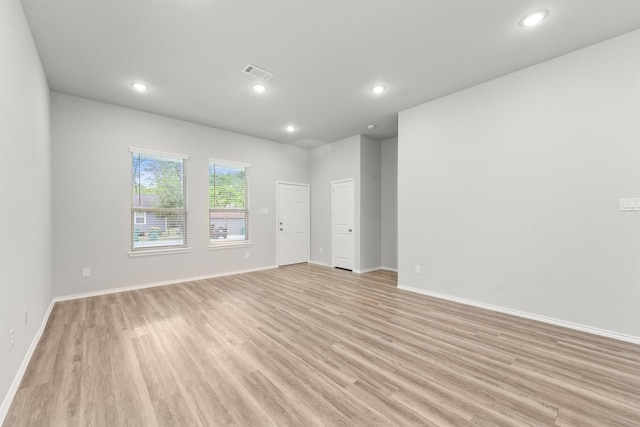 705 Little River Dr, Montgomery, TX 77316 - spare room featuring light wood-style floors, baseboards, and recessed lighting